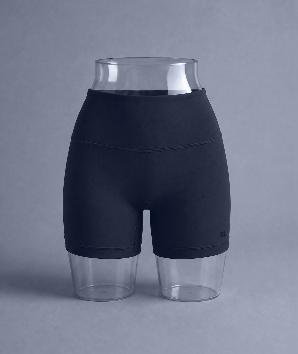 Bike Short in Navy, high-waisted bike short with a wide waistband displayed on a clear hip form