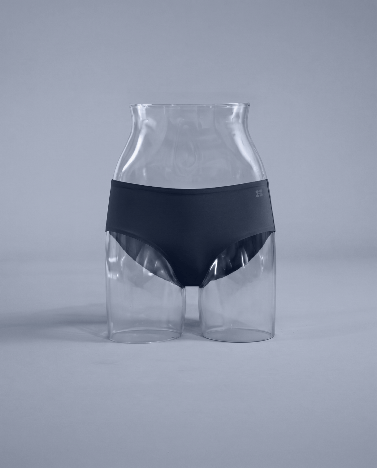 Daily Hipster in Navy, the seamless hipster on a clear display form from below the bust to mid-thigh