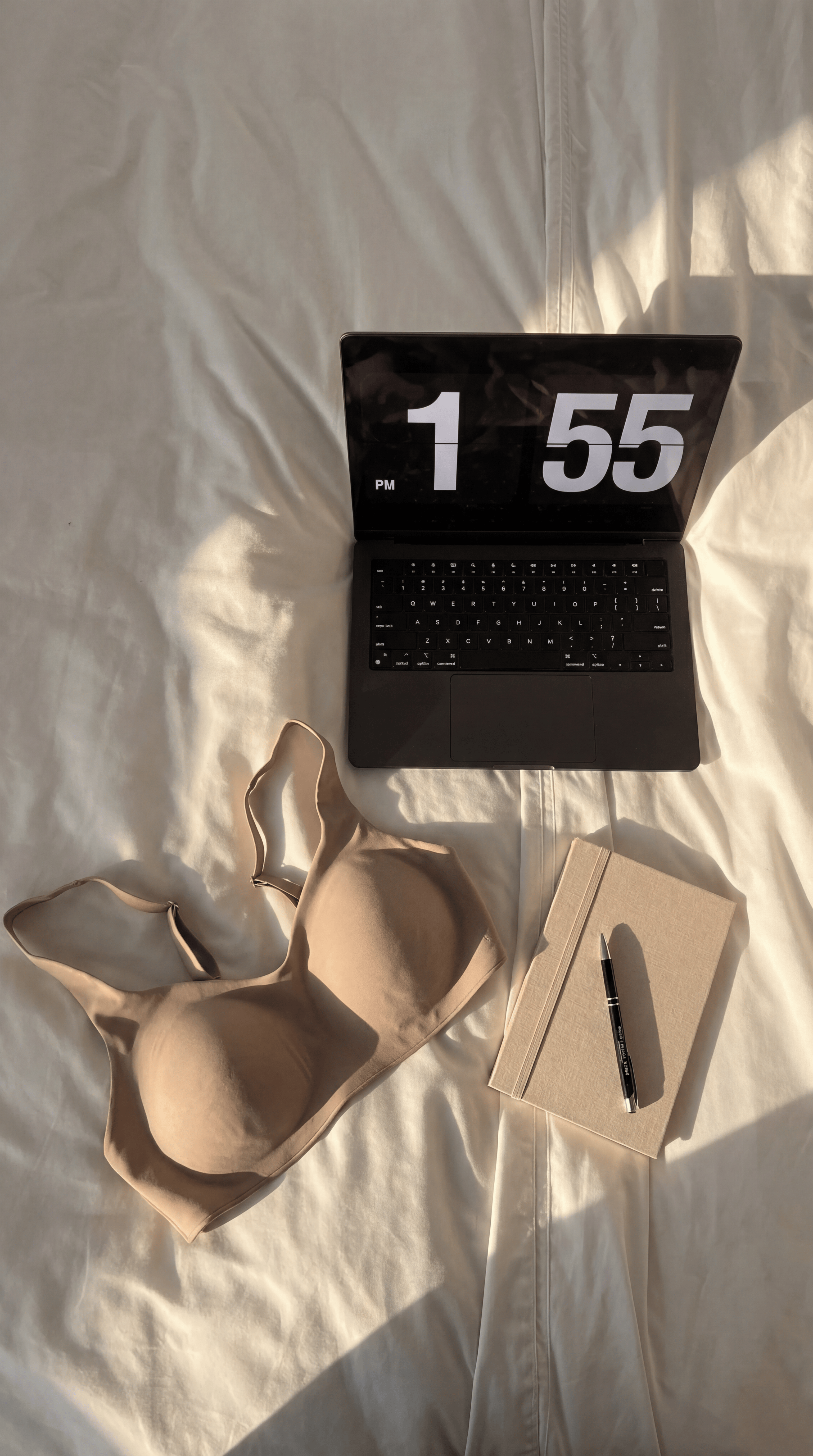 chai flatlay on bed with laptop